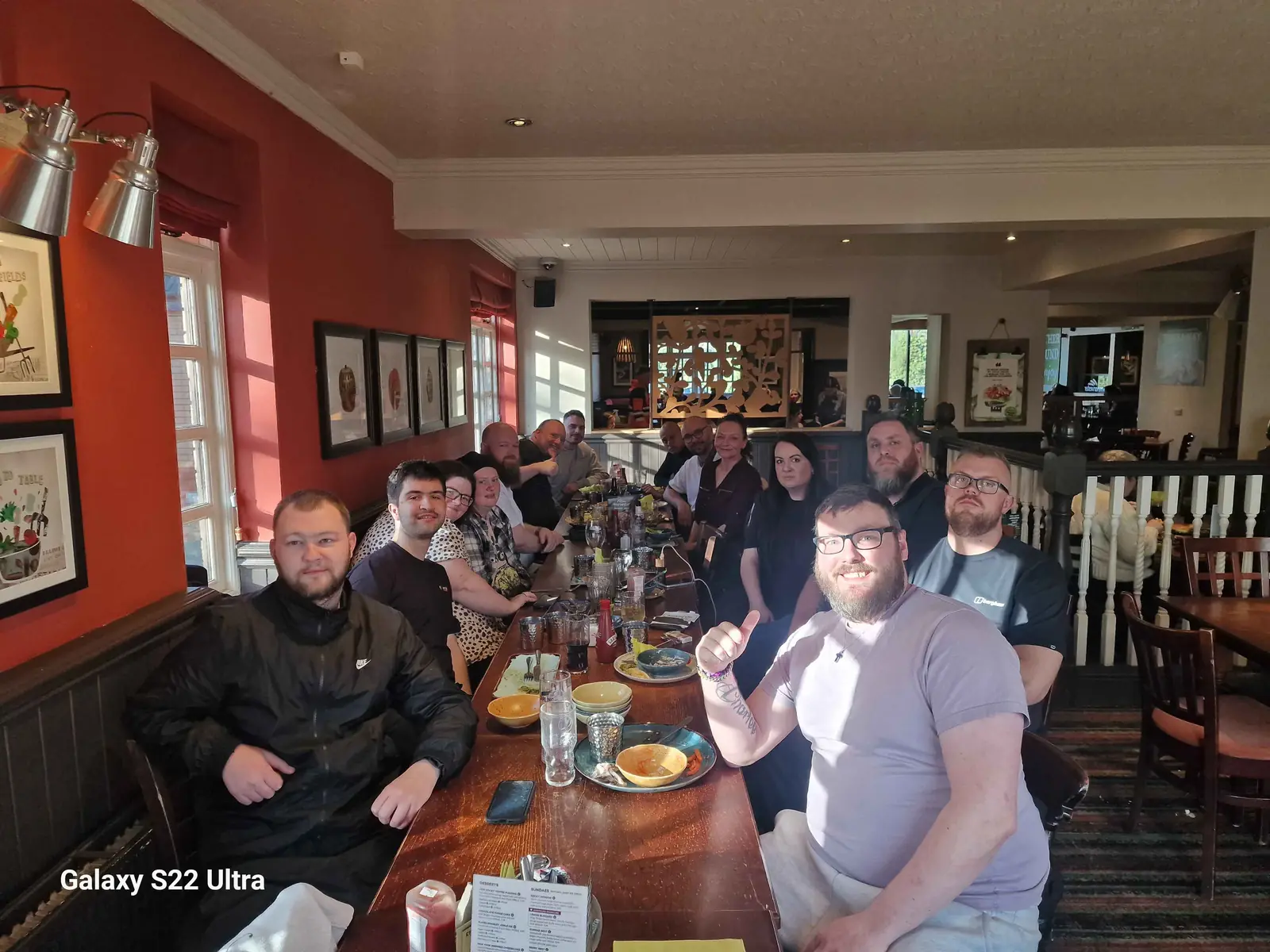 Lifted Spirits team members sharing a meal after a day out
