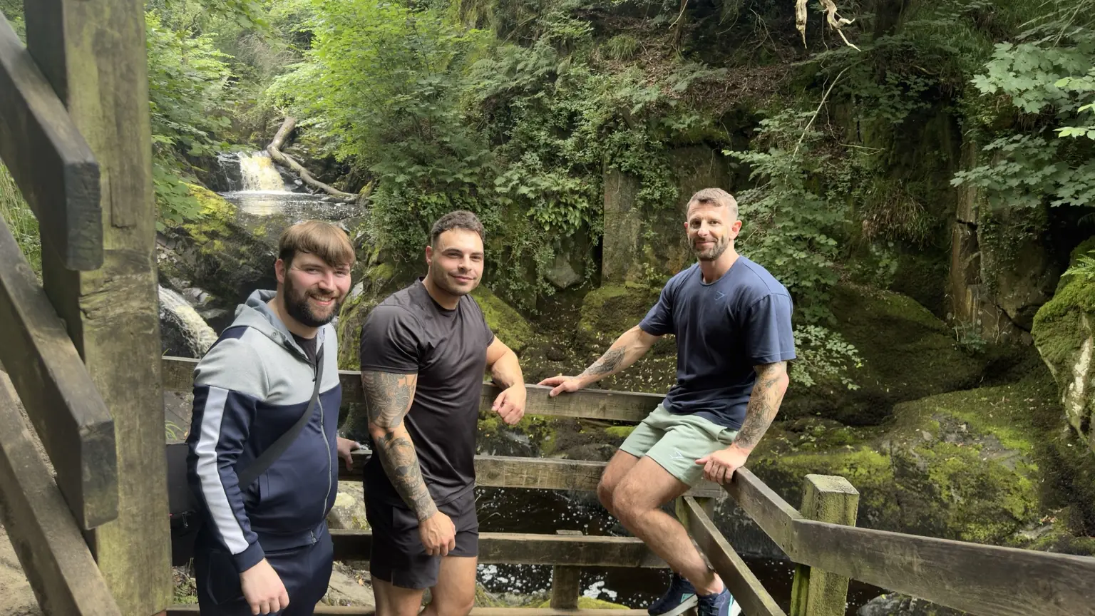 Lifted Spirits members beside a waterfall on the Ingleton Waterfalls Trail