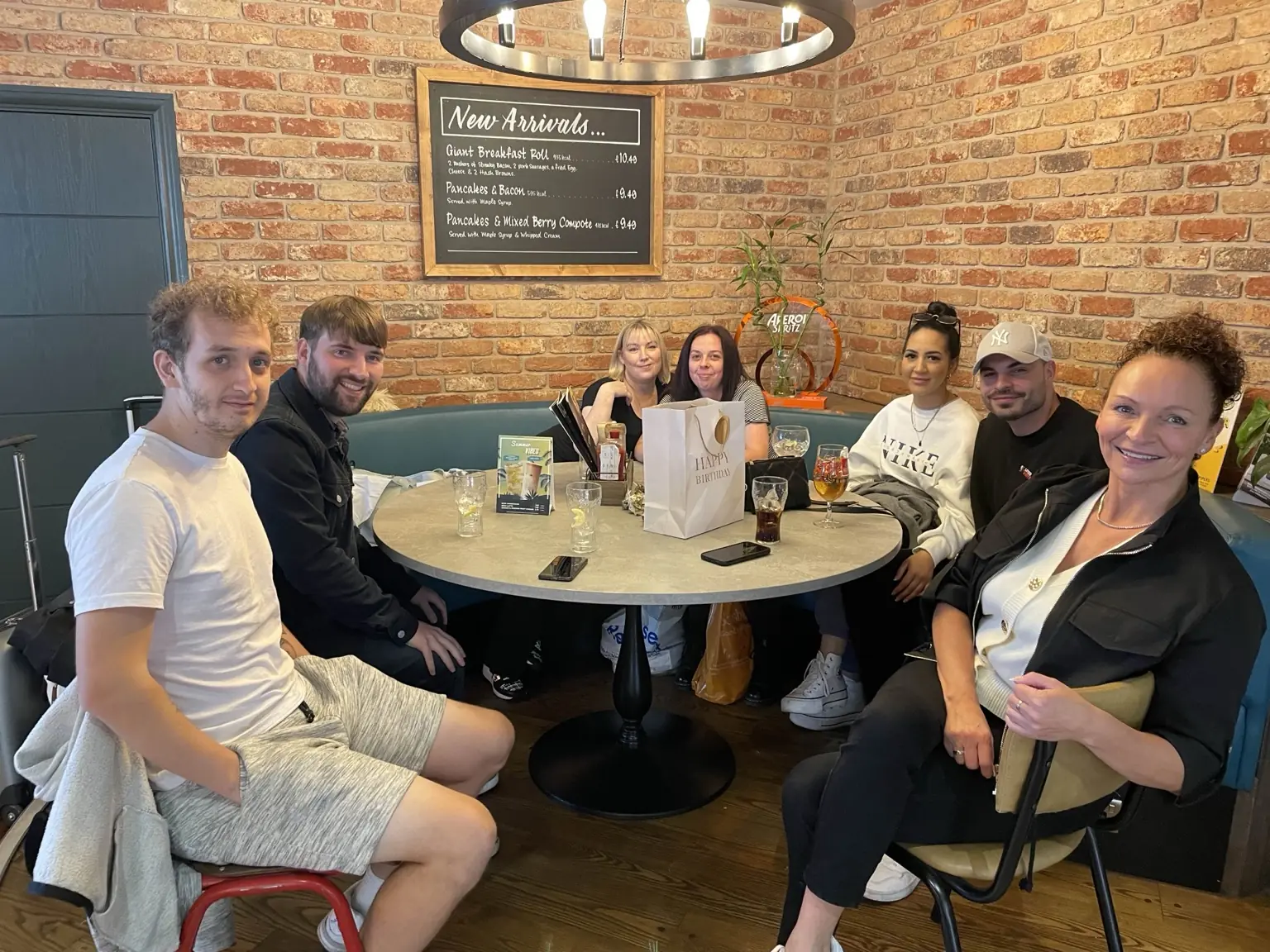 Lifted Spirits members sharing a meal during a London community meet-up