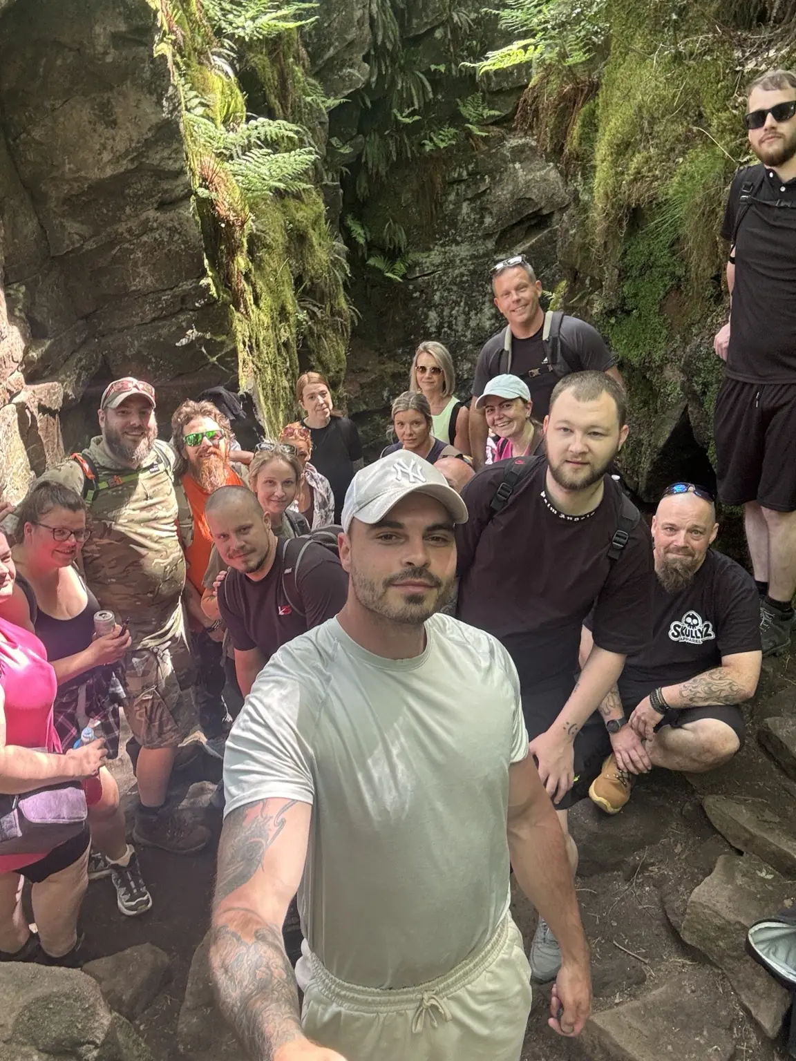 Lifted Spirits members together in the rocky landscape around Lud's Church